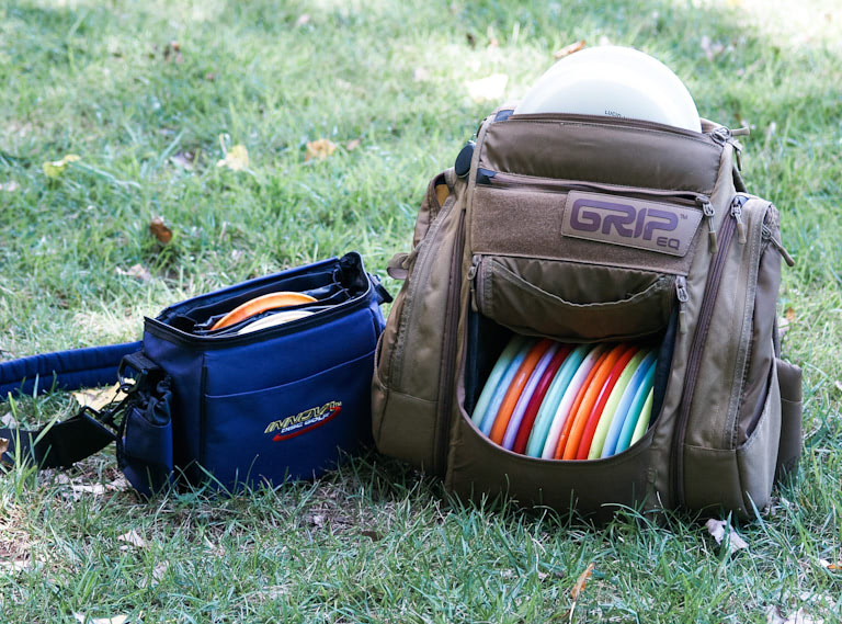 Small bag of discs next to a big bag of discs